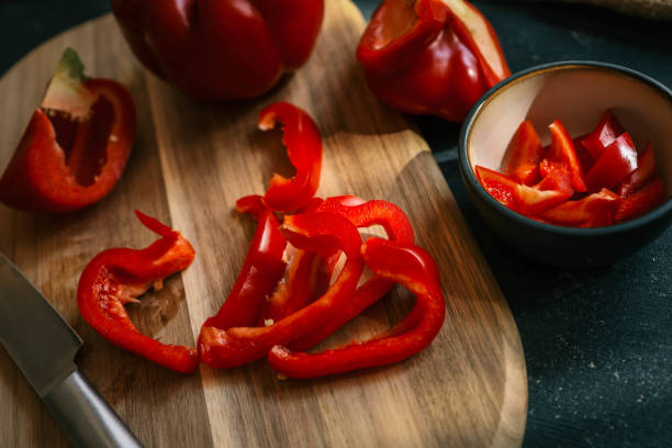 istock Girl cutting red pepper on a cutting board 2177967980