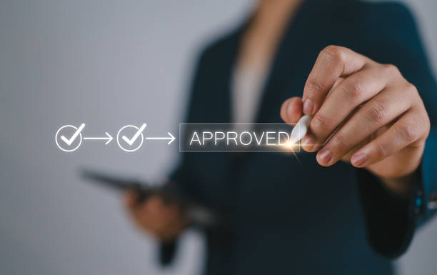 istock A businessman Hand Stamping With Approved Stamp On Document. Business process workflow illustrating management approval, flowchart with businessman in background 2177968758