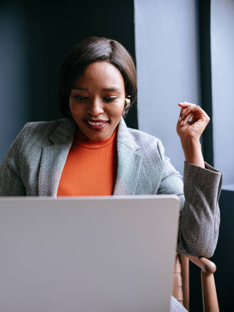 istock Focused Businesswoman Using Laptop in Modern Office Setting 2177969701
