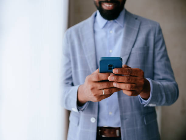 istock Businessman Engaged on Smartphone in Professional Setting 2177969704