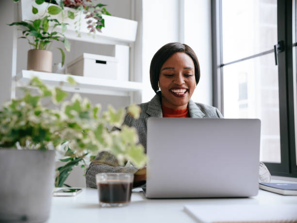 istock Smiling Professional Woman Working on Laptop in Modern Office 2177969758