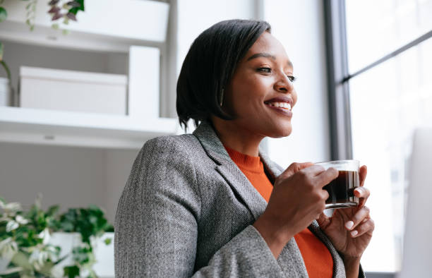 istock Confident Professional Woman Enjoying Coffee in Modern Office 2177969781
