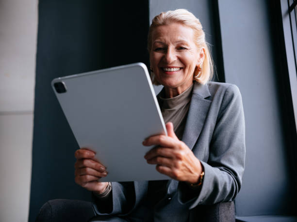 istock Confident Businesswoman Enjoying Work on Her Digital Tablet 2177969817