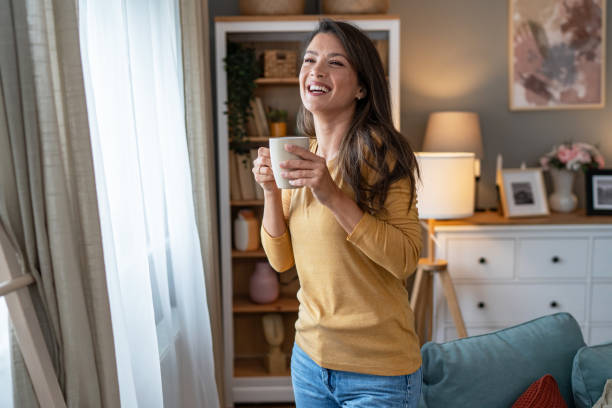 istock A young woman enjoys her morning coffee 2177970822