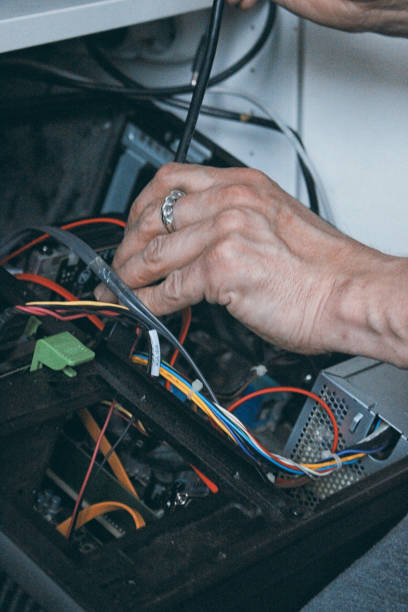 istock hands of a young man dismantling a computer into parts 2177974650