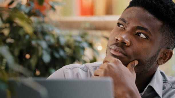 istock Close-up pensive confident manager freelancer working on laptop writes report thinks about solving problem startup new idea focused deep in thought young journalist writer thinking about writing novel 2177974668