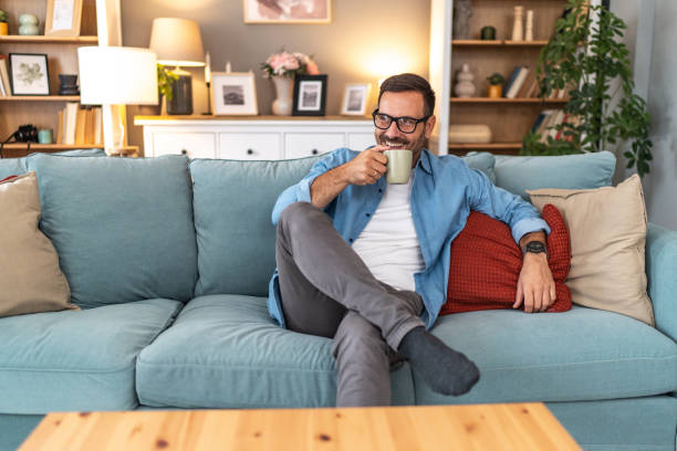 istock A young man drinks his morning coffee at home 2177974863