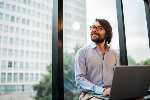 istock Young businessman contemplating and working using laptop at office 2177975054