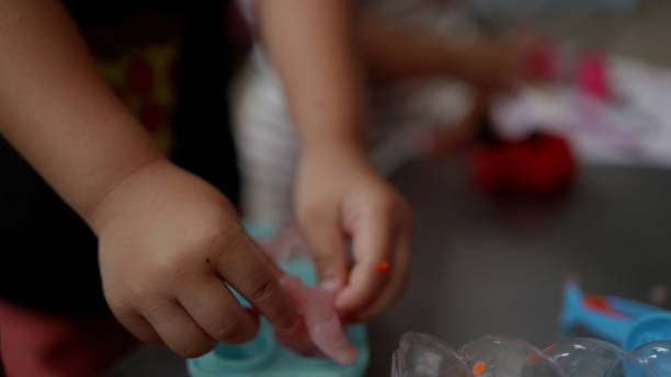 istock Happy Asian Boys enjoy playing slime with sister. 2177975426