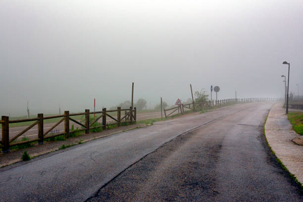 Sunrise in the Asturias mountains in Spain, with fog, in a solitary street