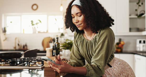 istock Cooking, kitchen and woman with smartphone, typing and   ideas for breakfast, digital and planning. House, web and person with mobile, contemplating and chef in morning, meal prep and confident 2177976323