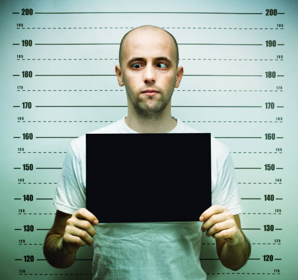 istock Young balded man posing for police mugshoot 2177976796