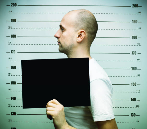 istock Young balded man posing for police mugshoot 2177976878