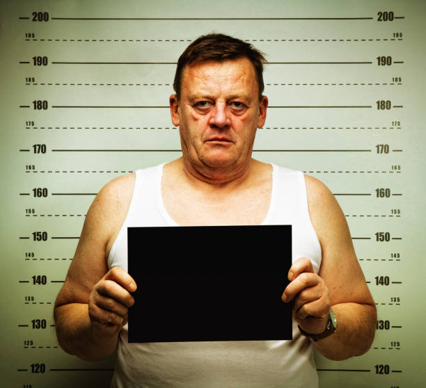 istock killer face senior man posing for police mug shot 2177976895