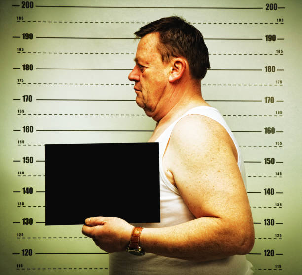 istock killer face senior man posing for police mug shot 2177977004