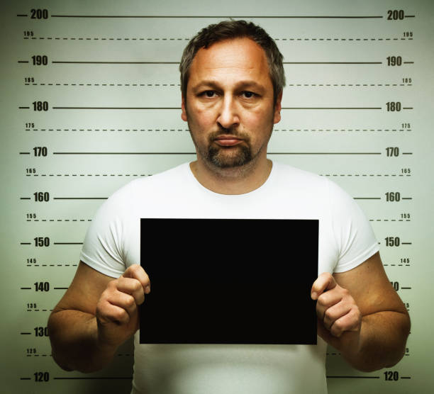 istock Man posing for police mug shot 2177977105