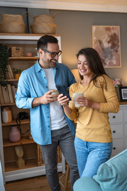 istock Young couple enjoys coffee in their home 2177977945