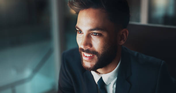 istock Night, thinking and man in office with smile, business plan and brainstorming ideas at digital agency. Research, overtime and happy businessman at desk with reflection, inspiration and working late 2177979107