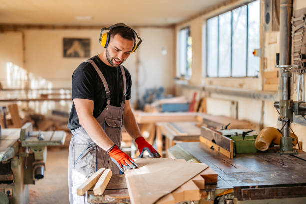 istock Young Male Carpenter Working With Wood In His Workshop 2177979375
