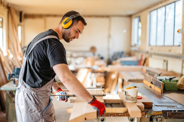 istock Young Male Carpenter Working With Wood In His Workshop 2177979434