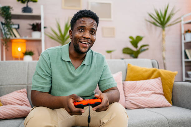 istock Young Man Playing Video Games On A Joystick At Home 2177981770