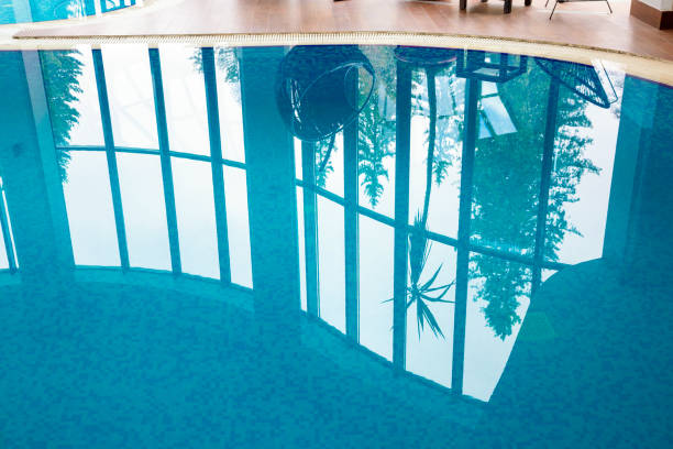 A Couple Relaxes in a Spa Pool, Soaking in the Tranquil Atmosphere. The Man and Woman Look at the Camera With Content Expressions, Showcasing a Peaceful, Rejuvenating Experience. Ideal for Promoting Spa Retreats, Relaxation, or Couple Wellness.