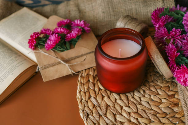 istock Candle and aster flowers in autumn interior 2177985122