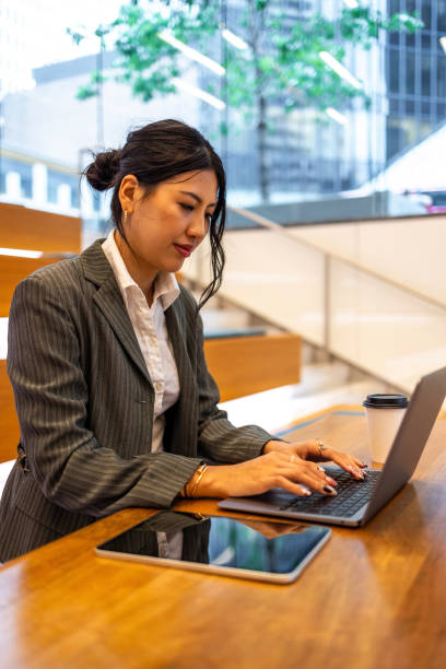 istock Businesswoman working in modern office setting with laptop 2177987941