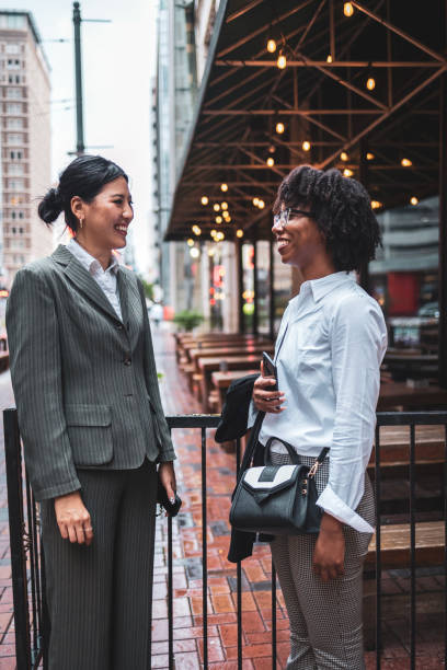 istock Two business women having a meeting outdoors in urban setting 2177988003