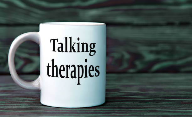 istock TALKING THERAPIES - the words on a white cup on a dark background. 2177988543