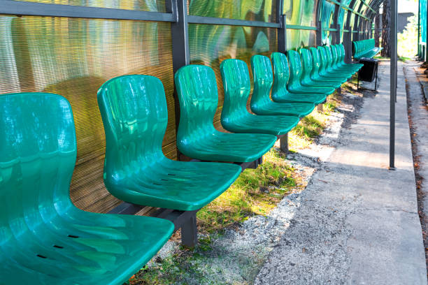 Rows of empty seats at a baseball stadium.