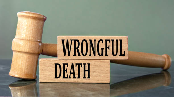 WRONGFUL DEATH - words on wooden blocks with a judge's gavel in the background WRONGFUL DEATH - words on wooden blocks with a judge's gavel in the background Wrongful Death Attorney stock pictures, royalty-free photos & images