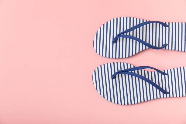 istock Flip flops on a bright colored background. Sandals. Summer Slippers. Vacation Concept. Rubber Slide Sandal . Top view. Space for text. Copy space 2177989233