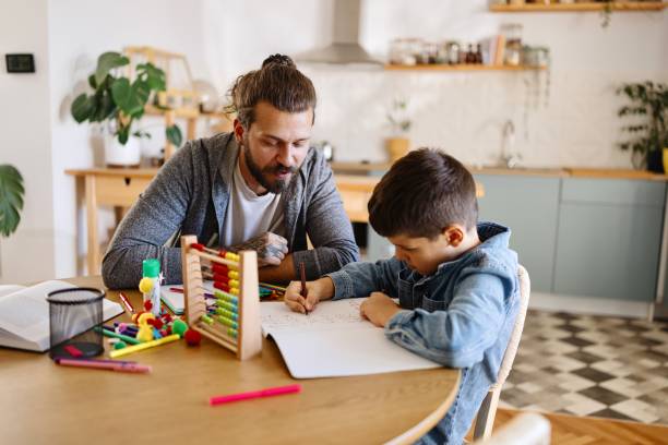 istock Father helping his son with homework 2177989789