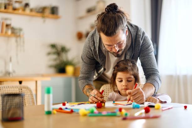 istock Father helping his daughter with a creative project 2177989892