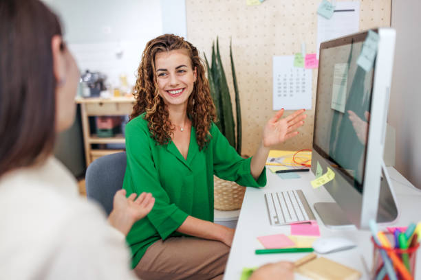 istock Two female colleagues talking while working together at modern office 2177990881