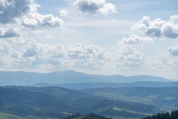 Sky over Mountains ranges. Green forest Nature cloud