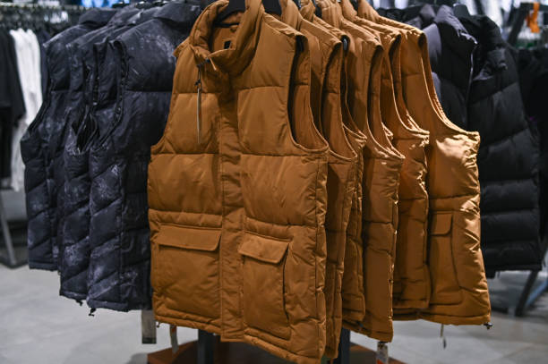 istock Sleeveless jackets hang on hangers in the store 2177997541