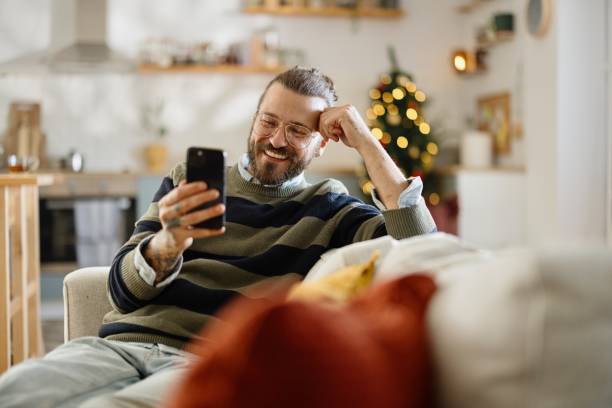 istock Smiling man having a video call with someone 2178000117