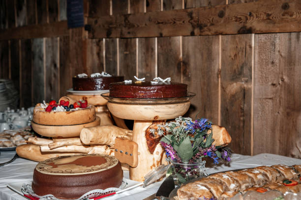 istock Rustic dessert table with chocolate cakes and fresh berries in a cozy wooden setting 2178002583