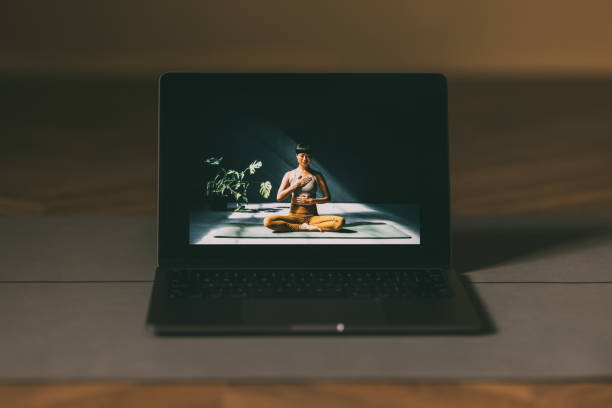 Online Yoga Class Displayed on Laptop Screen With Calm Ambiance