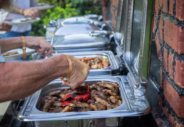 istock Guests order food from the self-service barbecue buffet 2178005217