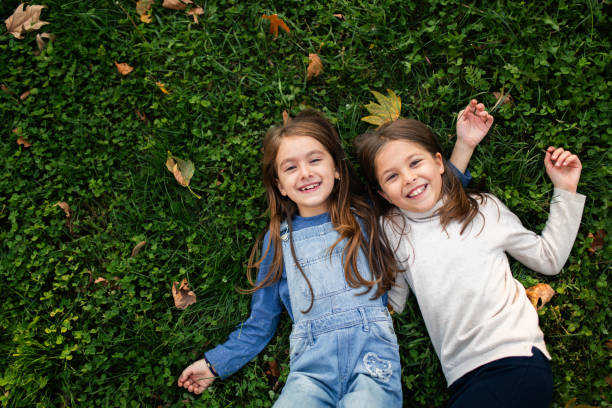 istock Two best friends playing in the park 2178006527