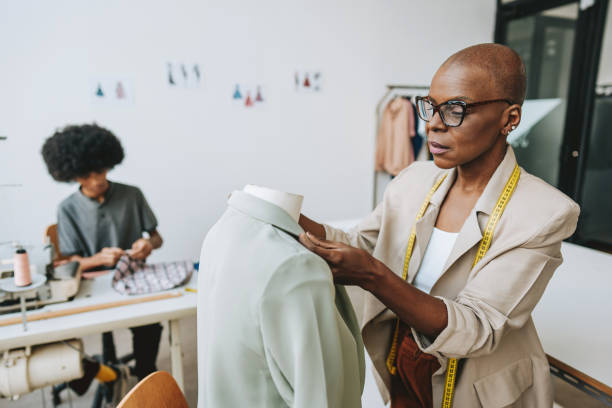 istock Seamstress in the stylist sewing studio 2178006645