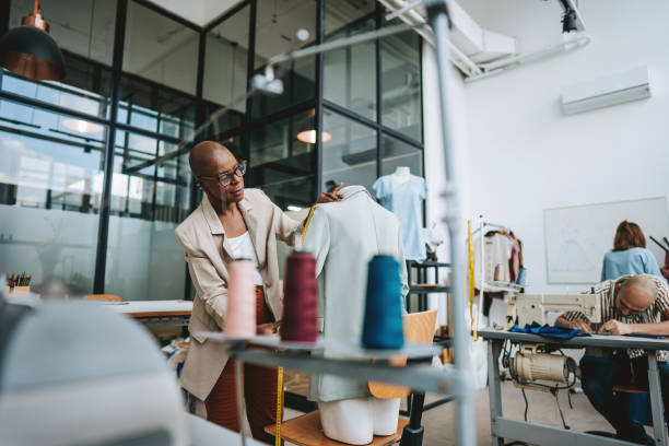 Seamstress in the stylist sewing studio