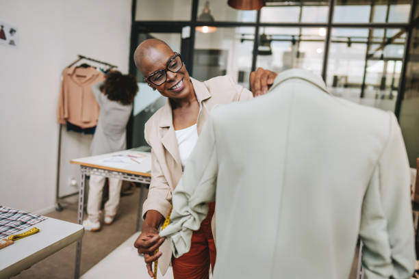 istock Seamstress in the stylist sewing studio 2178006667