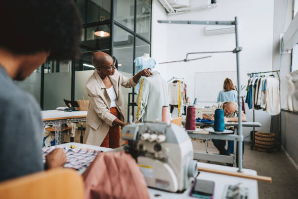istock Seamstress in the stylist sewing studio 2178006669