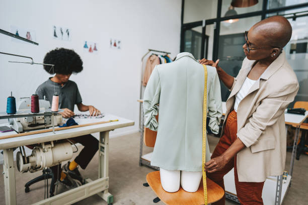 istock Seamstress in the stylist sewing studio 2178006671