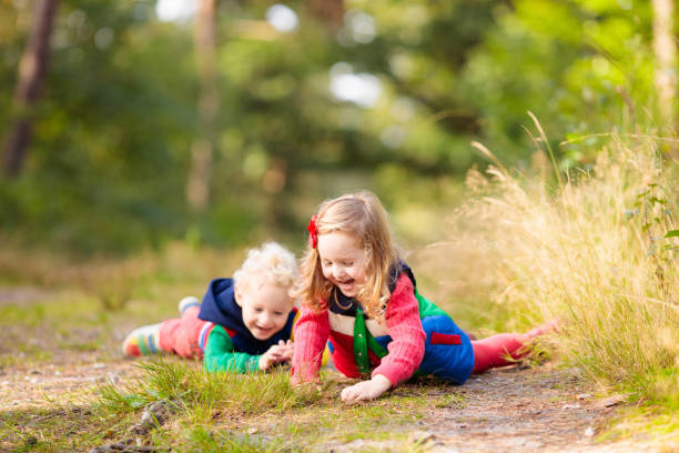 istock Kids hiking in autumn park 2178008604