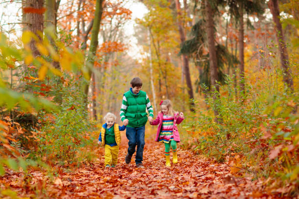 istock Kids playing in autumn park 2178008819